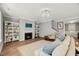 Bright living room featuring fireplace and built-in bookcases at 201 W Amber Oak Drive, Selma, NC 27576