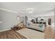 Open-concept living room with chandelier at 201 W Amber Oak Drive, Selma, NC 27576