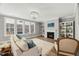 Bright living room featuring a fireplace, chandelier, and large windows at 201 W Amber Oak Drive, Selma, NC 27576