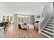 Inviting living room with wood floors, a cozy fireplace, and plenty of natural light at 201 W Amber Oak Drive, Selma, NC 27576