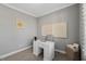 Cozy office space featuring neutral walls and carpet, with a simple desk and wall art at 201 W Amber Oak Drive, Selma, NC 27576