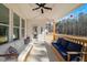 Relaxing covered porch with stylish furniture, offering a tranquil space to unwind and enjoy the fresh air at 201 W Amber Oak Drive, Selma, NC 27576