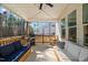 Welcoming screened porch with ample seating, ideal for enjoying outdoor living and entertaining at 201 W Amber Oak Drive, Selma, NC 27576