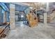Unfinished basement featuring a wooden staircase, offering potential for customization at 207 High House Rd, Cary, NC 27513