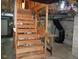 Staircase leading to the basement with exposed beams and ductwork at 207 High House Rd, Cary, NC 27513