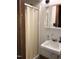 Compact bathroom features a shower stall, sink with vanity, and mirrored cabinet at 207 High House Rd, Cary, NC 27513