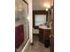 Bathroom featuring a shower with a sliding door, vanity, and a window at 207 High House Rd, Cary, NC 27513