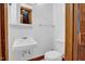 Clean bathroom with a white sink and toilet, featuring a medicine cabinet and classic fixtures at 207 High House Rd, Cary, NC 27513