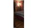 Bedroom showcasing wood paneled walls, flooring, and soft lighting at 207 High House Rd, Cary, NC 27513