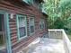 Charming log home with a deck and multiple windows to bring the outdoors in at 207 High House Rd, Cary, NC 27513