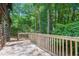 Wooden deck overlooking a lush, green yard, perfect for outdoor entertaining at 207 High House Rd, Cary, NC 27513