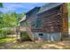 Exterior of a log cabin featuring a deck, back door and outdoor access at 207 High House Rd, Cary, NC 27513