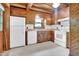 Functional kitchen featuring light countertops, white appliances, and warm wood cabinetry for storage at 207 High House Rd, Cary, NC 27513