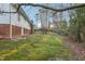 Expansive backyard with mature trees and lush green grass at 209 High House Rd, Cary, NC 27513