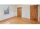 Bright bedroom features hardwood floors, closet, and natural light from a large window at 209 High House Rd, Cary, NC 27513