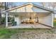 Large carport features ramp and covered area with white siding at 209 High House Rd, Cary, NC 27513