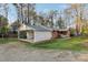 View of attached carport showing the full side of the brick home at 209 High House Rd, Cary, NC 27513