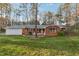 Charming brick home with inviting front porch and well-maintained lawn in a treed neighborhood at 209 High House Rd, Cary, NC 27513