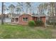 Beautiful brick home with lush lawn, complemented by a covered porch entry at 209 High House Rd, Cary, NC 27513