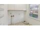 Laundry room with a window and storage at 209 High House Rd, Cary, NC 27513