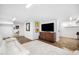 Finished basement with a white couch, TV, and sports memorabilia at 2105 White Oak Rd, Raleigh, NC 27608