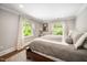 Cozy bedroom with large windows offering natural light and comfortable furnishings at 2105 White Oak Rd, Raleigh, NC 27608