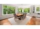 Dining room with large windows providing natural light and views of the landscape at 2105 White Oak Rd, Raleigh, NC 27608