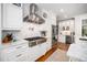 Gourmet kitchen with high-end stainless steel appliances, marble countertops and custom cabinets at 2105 White Oak Rd, Raleigh, NC 27608