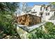 Charming stone water feature surrounded by lush greenery, enhancing the serene ambiance of the property's backyard at 2105 White Oak Rd, Raleigh, NC 27608