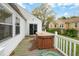 Exterior view of a home's back deck with an included hot tub and white wood railing at 2106 Ruffin St, Durham, NC 27704