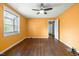 Bedroom featuring wood floors, a ceiling fan, and a bright window view at 2106 Ruffin St, Durham, NC 27704