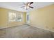 Bedroom with a carpeted floor, ceiling fan, and door leading to the outside at 2106 Ruffin St, Durham, NC 27704