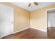 Bedroom with wood floors, a ceiling fan, and a view of the neighborhood at 2106 Ruffin St, Durham, NC 27704