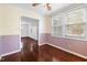 A dining room with hardwood floors, neutral paint colors, wainscoting and a ceiling fan at 2106 Ruffin St, Durham, NC 27704