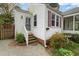 Charming home with a well-maintained exterior, steps to the front door and landscaped garden at 2106 Ruffin St, Durham, NC 27704