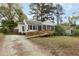 Charming home with a wooden ramp and screened porch, offering accessibility and outdoor enjoyment at 2106 Ruffin St, Durham, NC 27704