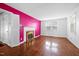 Bright living room featuring hardwood floors, white trim, a fireplace and lots of natural light at 2106 Ruffin St, Durham, NC 27704