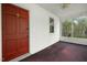 Inviting enclosed porch with bright natural light and a classic paneled wall at 2106 Ruffin St, Durham, NC 27704