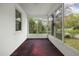 Bright and airy enclosed porch with plenty of windows offering serene views at 2106 Ruffin St, Durham, NC 27704