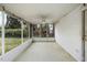 A screened porch with ceiling fan and views of the yard at 2106 Ruffin St, Durham, NC 27704