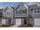 Beautifully designed townhome exterior with varied siding, stone accents, and attached garages at 2114 Willow Gln Dr, Graham, NC 27253