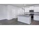 Bright kitchen featuring stainless steel appliances, granite countertops, white cabinets, and hardwood flooring at 2118 Willow Gln Dr, Graham, NC 27253