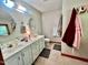 Well-lit bathroom featuring double sinks and vanity, offering plenty of space at 212 Columbia W Pl, Chapel Hill, NC 27516