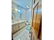 Clean bathroom with double sinks, tile flooring, and neutral colors at 212 Columbia W Pl, Chapel Hill, NC 27516