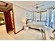 Comfortable bedroom with natural light, including a ceiling fan and adjacent bathroom at 212 Columbia W Pl, Chapel Hill, NC 27516