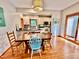 Dining area that opens into a kitchen, with a view of the stainless steel appliances at 212 Columbia W Pl, Chapel Hill, NC 27516