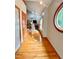 Inviting entryway with hardwood floors, arched window, and a view into the living room at 212 Columbia W Pl, Chapel Hill, NC 27516