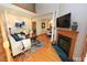 Bright living room features hardwood floors, a fireplace, and comfortable seating at 212 Columbia W Pl, Chapel Hill, NC 27516