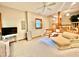 Inviting living room with a ceiling fan, wooden staircase and a comfortable chaise lounge at 212 Columbia W Pl, Chapel Hill, NC 27516