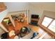 Aerial view shows living room open to dining and kitchen with hardwood floors at 212 Columbia W Pl, Chapel Hill, NC 27516